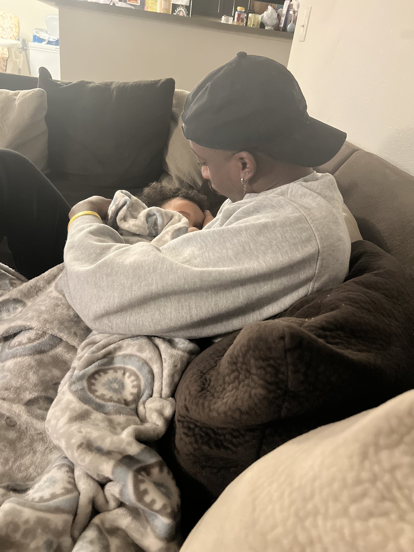A quiet moment holding a sleeping baby
